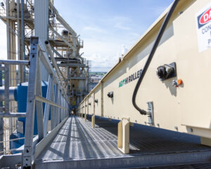 Close-up shot of conveyor being installed at grain facility with Nebraska millwright services